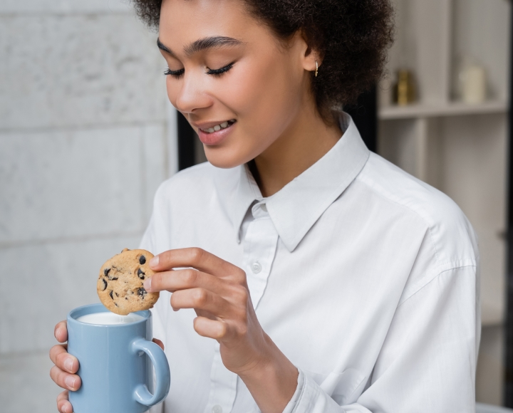 Lady eating a cookie